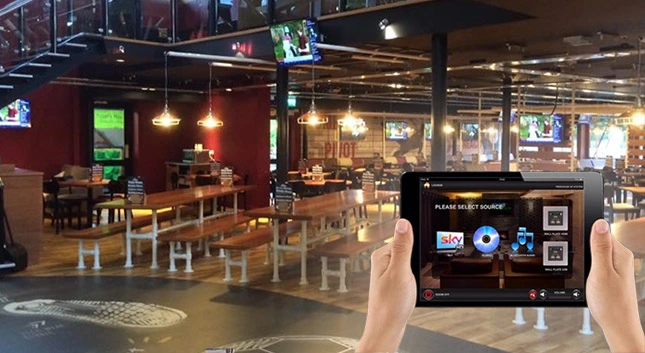 Tablet showing Designer Project in a sports bar